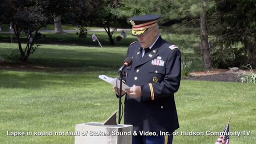 Veteran Speaking Into A Mic